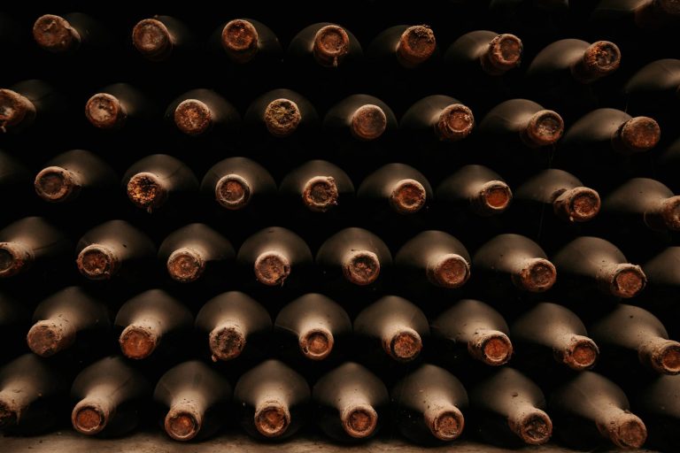 bottles of old wine in dusty cellars. old bottles of in wine cellar